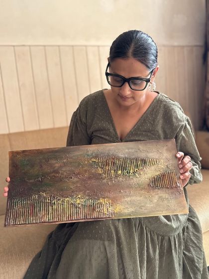 Holding another piece from my Wabi-Sabi inspired series. The horizontal lines and earthy tones create a sense of calm and stability.