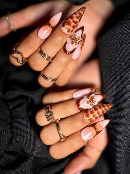 A full view of both hands, showing a cohesive yet creative nail art set.