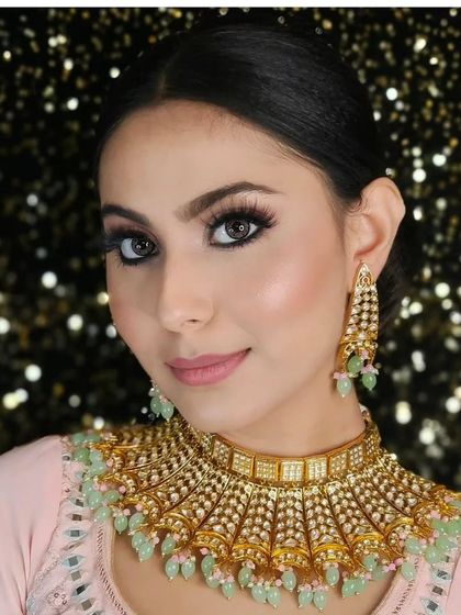 A close-up of a beautiful choker with light green beading, perfect for a subtle and elegant look for a sangeet or engagement ceremony.