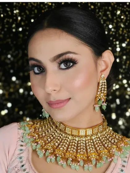 A close-up of a beautiful choker with light green beading, perfect for a subtle and elegant look for a sangeet or engagement ceremony.