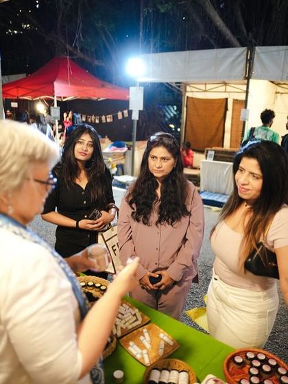 Our co-founder Sonia Dhawan interacting with visitors at a stall, sharing the stories behind the natural, handcrafted wellness products.