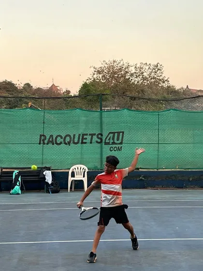 A young player executes a forehand with perfect form, showcasing the results of dedicated training and expert coaching at our academy.