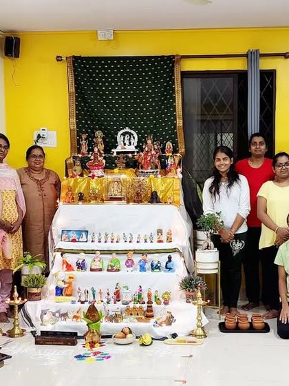 A group photo with our students and the beautiful Navaratri Golu display, celebrating the festive spirit at our studio.