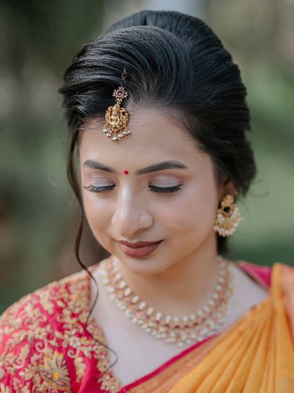 A close-up on the makeup, with eyes closed to showcase the soft, blended eyeshadow.