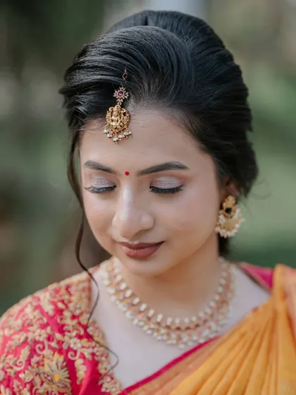 A close-up on the makeup, with eyes closed to showcase the soft, blended eyeshadow.