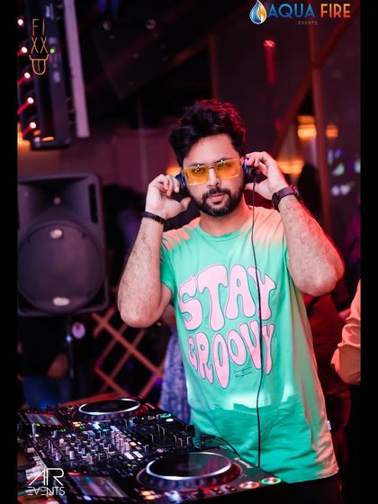 Stay Groovy. That's the motto. Getting ready to spin at The Fixx, headphones on, ready to feel the beat.