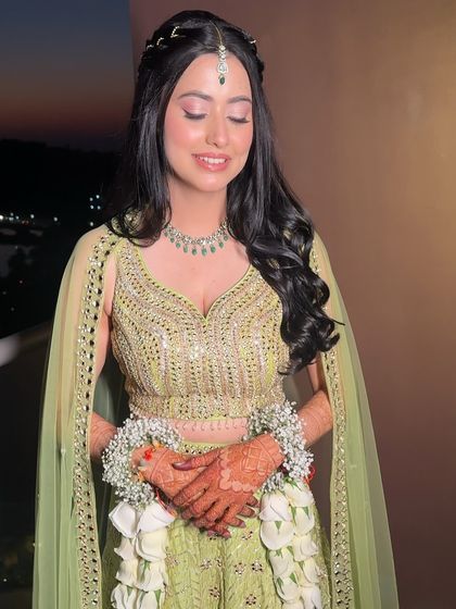 A close-up of Shweta's Mehendi makeup. The soft pink eyeshadow and glowing skin create a look that is pretty and perfect for a daytime event.