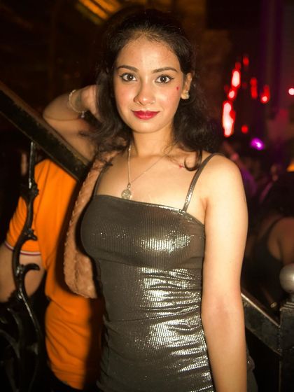 A stylish guest posing on the stairs.