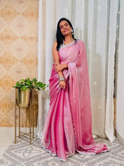 This soft pink velvet saree is so unique and perfect for winter weddings. The fabric is luxurious and the color is soft and romantic.