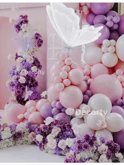 A duplicate shot of the elegant floral centerpiece with floating balloons, perfect for a princess-themed party.