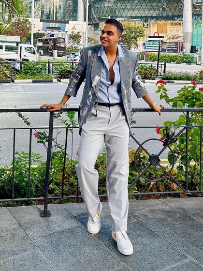 Shravan Shah in the Paradox Suit jacket, featuring a shawl lapel with intricate embroidery and silver studs for a modern, stylish twist.