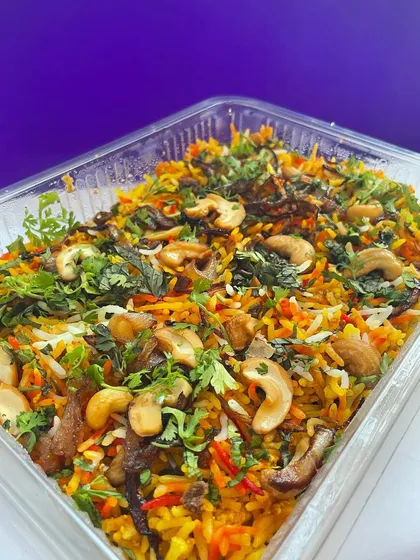 Another angle of the delicious vegetable biryani, showcasing the vibrant colors and fresh ingredients.