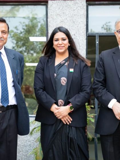 A professional portrait with two senior members of the judging panel. The opportunity to work alongside and learn from such experienced legal minds is invaluable.