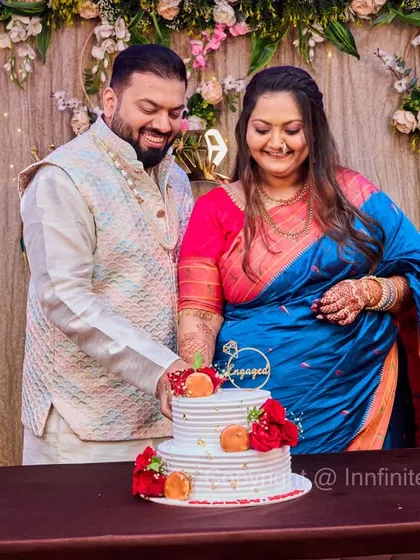 A happy couple cutting their engagement cake together. I capture these celebratory traditions that are part of the event's festivities.