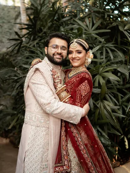 A joyful, classic portrait of the happy couple, embracing and smiling for the camera.