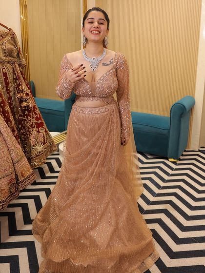 A full, happy twirl from a client in our rose-gold fish-cut lehenga. Seeing our clients this happy is what it's all about.