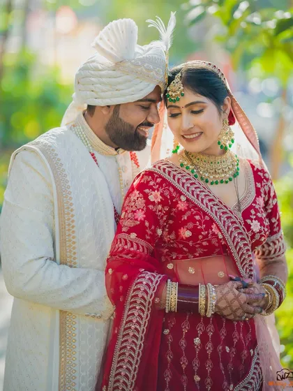 An intimate portrait of a Sindhi couple, their faces close together, capturing the love and happiness of their wedding day.