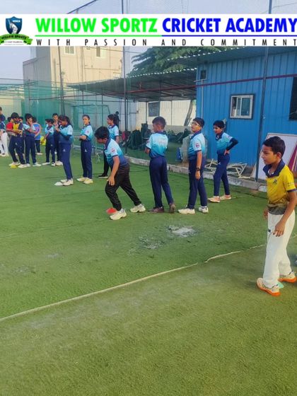 A snapshot of a fielding drill session. Focus, discipline, and dedication are visible as our players prepare to take catches.