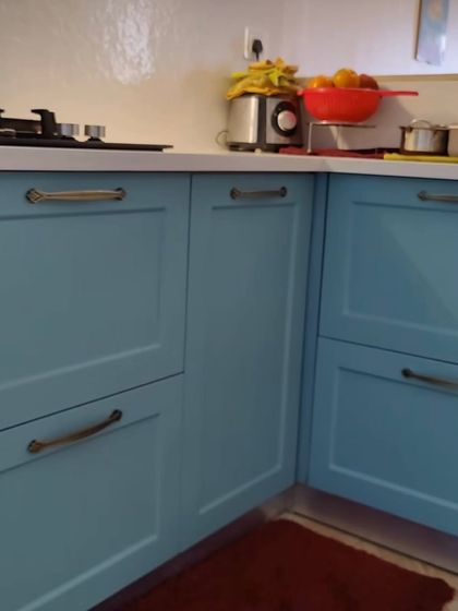 Different shots from our Lotus Boulevard project, where we opened up the kitchen to the dining area. The French-style blue kitchen, dining nook, and colorful decor create a vibrant and interactive living space.