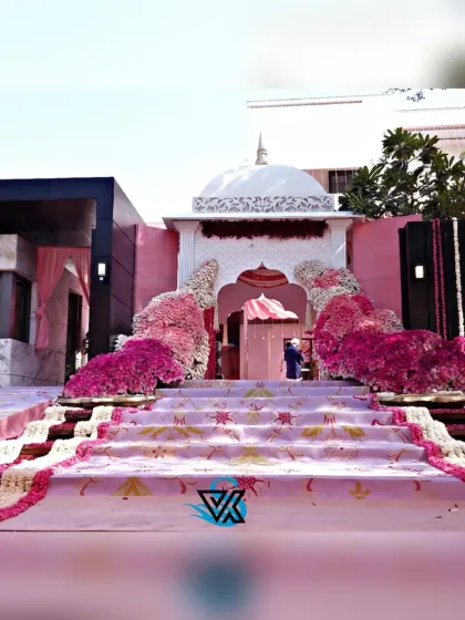 A grand entrance for a beautiful beginning. We crafted this palatial archway for an Anand Karaj ceremony, using thousands of fresh flowers in shades of pink to create a breathtaking welcome.