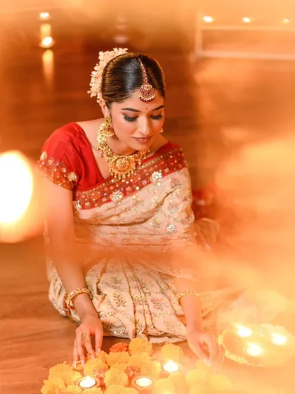 A dreamy, candlelit shot from our Diwali series. The makeup looks soft and luminous in the warm light.
