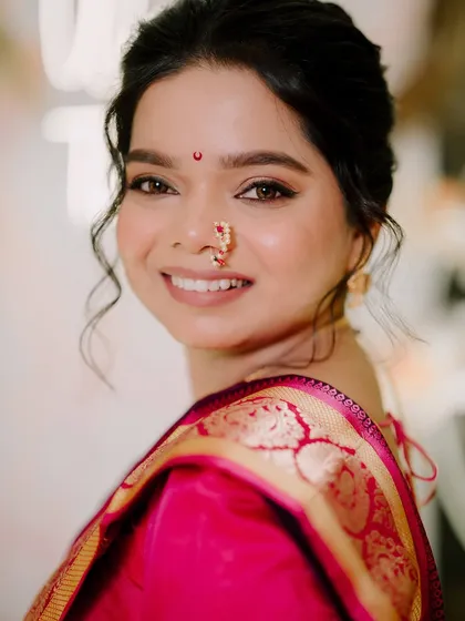 A beautiful close-up portrait of the bride, showcasing her flawless skin and bright smile.
