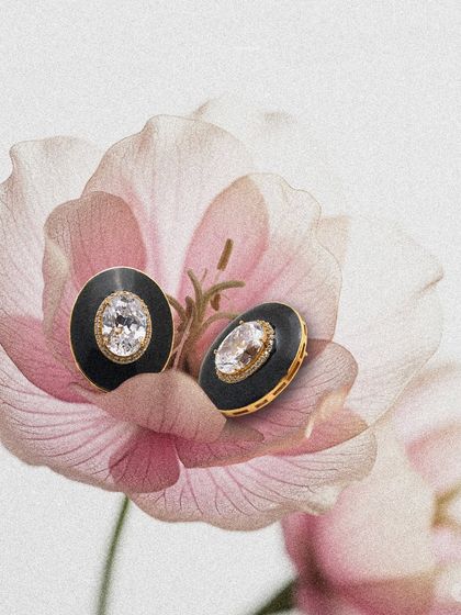 The Numisma Nyx Studs captured in a floral setting, highlighting their versatile beauty. These are perfect for taking you from a day at the office to a special evening out.