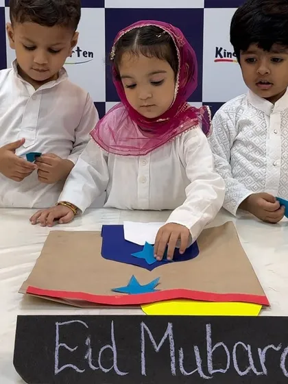 Little hands carefully crafting an Eid card. These hands-on activities help children connect with the festival's themes of community and giving.