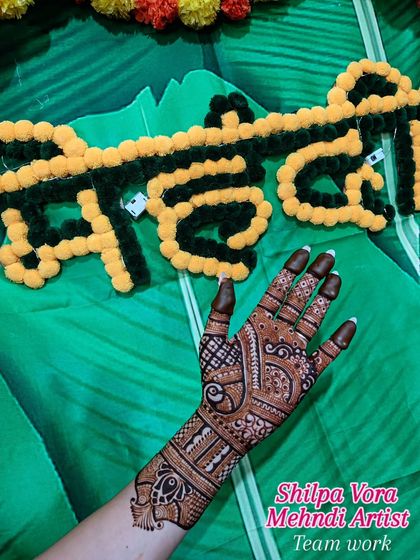 My work on display at a mehndi event. I love being part of festive celebrations and sharing my art.