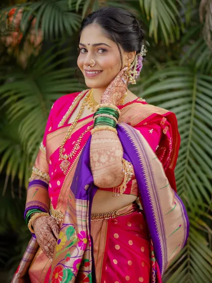 A full and happy smile from my bride, dressed in a stunning pink and purple Paithani. Her complete look, from the makeup to the perfectly draped saree, radiates joy.
