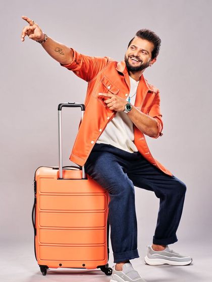 For the travel-themed portion of the Kinghill Travels ad, I styled Suresh Raina in a bright orange jacket and relaxed denim, creating a fresh and approachable look.
