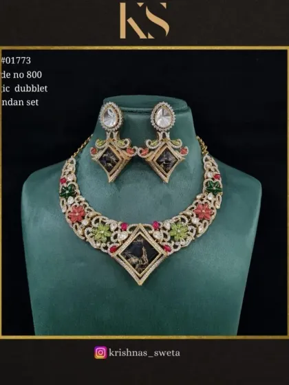 This magic dubblet Kundan set in black and multi-color is a bold and dramatic choice. It's perfect for someone who wants to make a unique style statement.