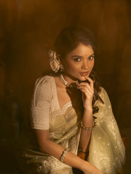 A collection of images from a retro-themed photoshoot with the beautiful actress Sanjana Tiwari. I created a soft, classic hairstyle with side-swept curls and floral accents to match the vintage aesthetic.