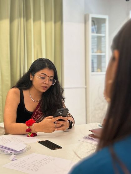 A participant engrossed in the conversation, sharing her thoughts with the group.