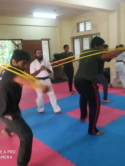 I oversee the resistance band training, ensuring every student maintains correct form and intensity.