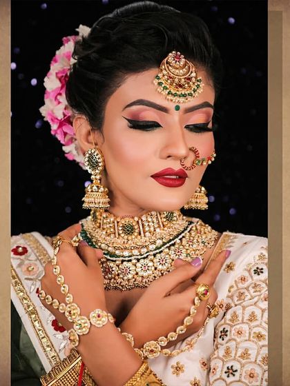 A bride showcasing her full look with a hathphool from our rental collection.