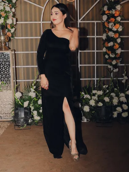 A classic one-shoulder black gown for a corporate launch party. It's simple, elegant, and exudes professionalism.