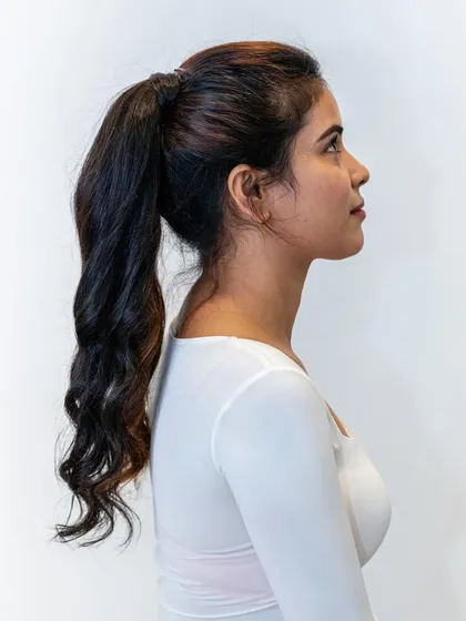 This is the final look of our wrap-around ponytail extension. It creates a full, high-volume ponytail that looks completely natural and is perfect for a quick, glamorous hairstyle for any occasion.
