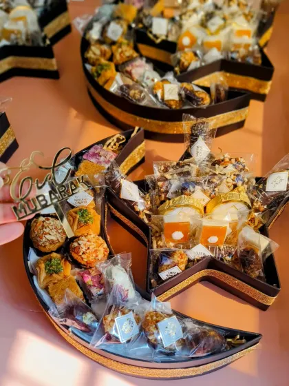 My 'Chand Taara' gourmet hamper is a favorite for Eid celebrations. The unique crescent and star shape is filled with traditional sweets like baklava and premium dates, making it a visually stunning and delicious gift.