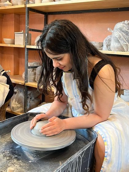 Kicking off the summer with a splash of creativity. A student enjoys the relaxing and fun process of wheel-throwing in our taster session.