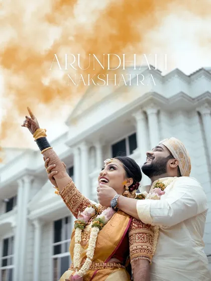 A wedding portrait can be more than just a photo; it can be a story. This powerful shot captures a couple during a sacred ritual, their expressions full of hope and joy as they look towards the stars and their future.