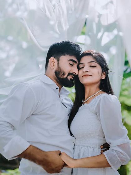 An intimate embrace surrounded by flowing white curtains. This shot is soft, dreamy, and incredibly romantic.
