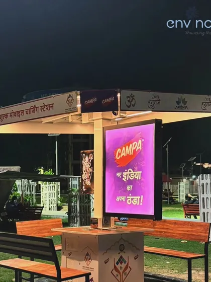 The vibrant digital screen on our solar hut displays an advertisement at night, demonstrating its potential as a revenue-generating asset for the city while providing a free public service.