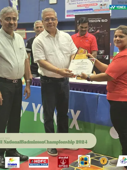 A female team member being felicitated for her role in the successful management of the national tournament. I am proud to have a diverse and capable team.