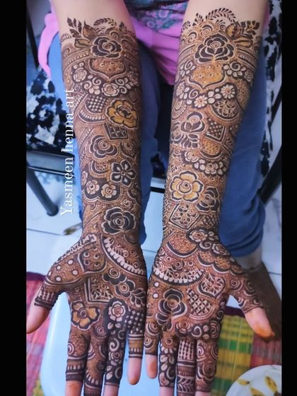 A full arm design showcasing a variety of techniques, including shaded roses, fine lines, and bold patterns.