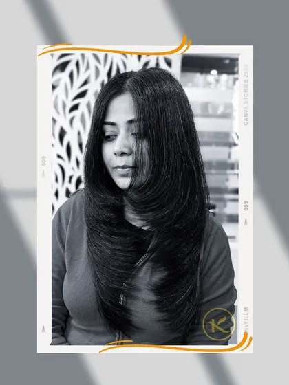 A beautiful example of a long layered haircut, also known as a feather cut. This style removes weight while maintaining length, resulting in bouncy, well-defined layers.