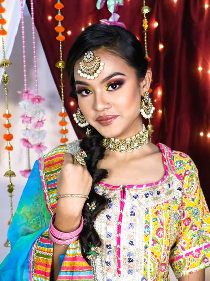 A beautiful rainbow eyeshadow look, perfect for a bride who wants to experiment with color for her Haldi or Mehendi. The look is bold, festive, and absolutely stunning.