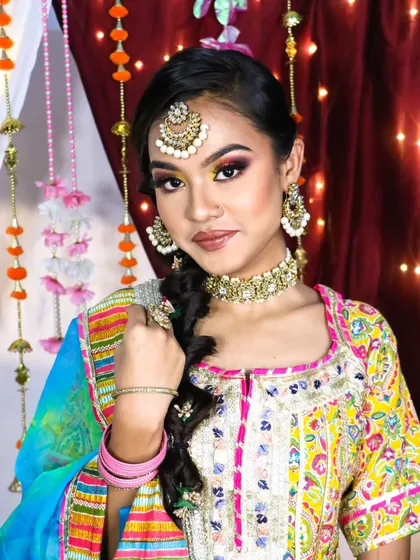 A beautiful rainbow eyeshadow look, perfect for a bride who wants to experiment with color for her Haldi or Mehendi. The look is bold, festive, and absolutely stunning.