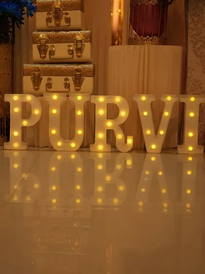 A close-up of the light-up marquee letters used in one of my butterfly themes. The reflection on the shiny floor adds to the glamour.