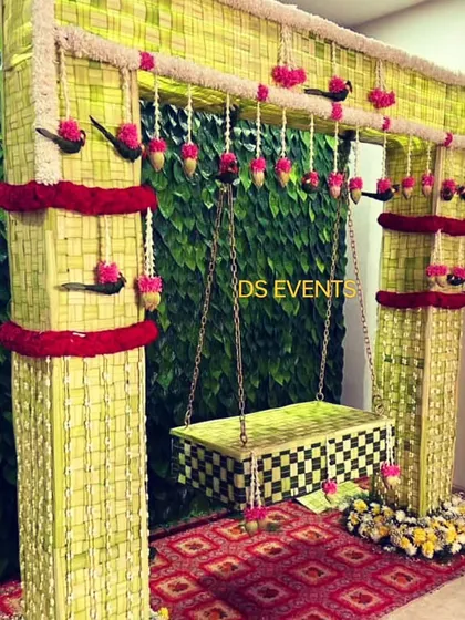 For a beautiful and eco-friendly naming ceremony, I designed this swing and backdrop entirely from woven coconut leaves. It’s a testament to how traditional materials can create stunning, sustainable decor.